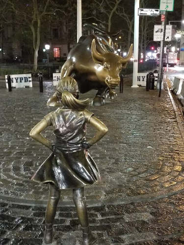Girl in front of Charging Bull